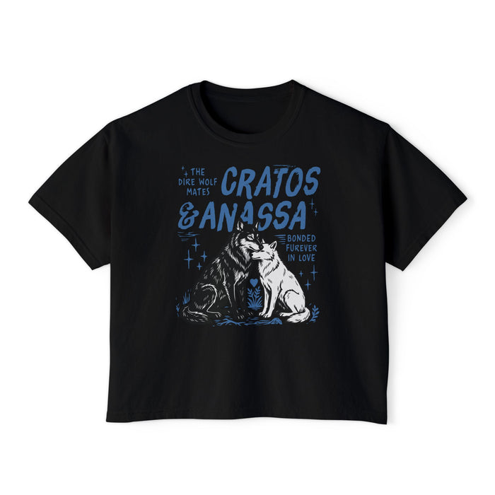 Wolves of Ruin collection from thtgrlreads features a vintage-wash black Comfort Colors crop top with a blue graphic of Cratos and Anassa wolves and romantic text, Printify.