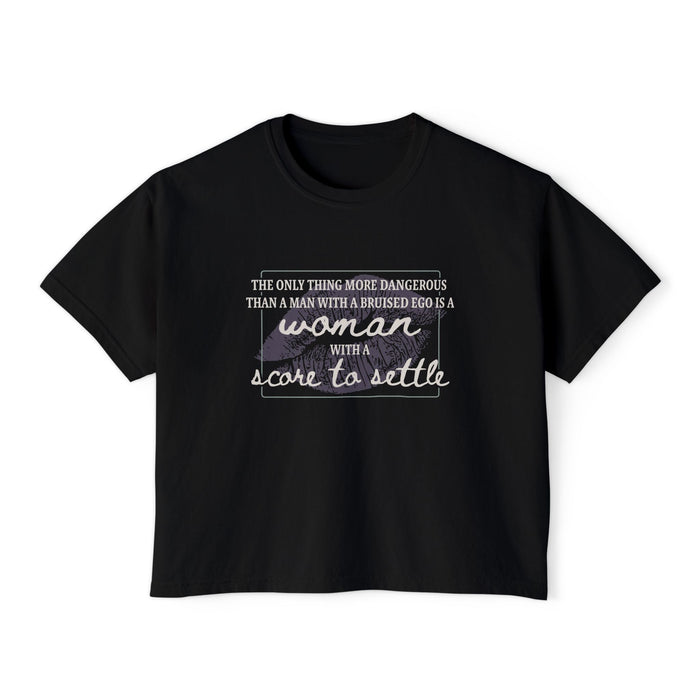 A black Comfort Colors women's cropped tee from thtgrlreads featuring a vintage wash and a printed quote in mixed fonts from The Poison Daughter collection.