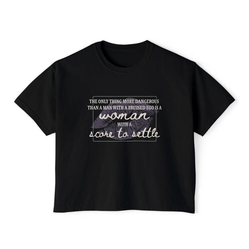 A black Comfort Colors women's cropped tee from thtgrlreads featuring a vintage wash and a printed quote in mixed fonts from The Poison Daughter collection.