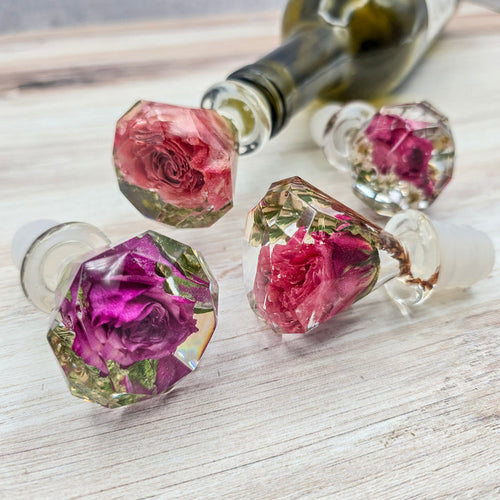 Square close-up of a pressed flower resin piece with blush dried roses