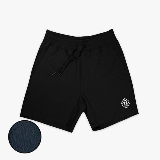 Adult model wearing black Diamond Tech Jacquard shorts