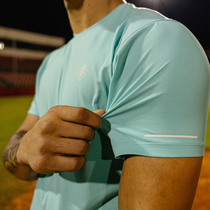 Adult model wearing blue Diamond Tech Vented Teal graphic tee