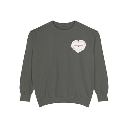 thtgrlreads officially licensed The Poison Daughter collection crewneck sweatshirt in vintage-washed Comfort Colors fabric, featuring a delicate heart graphic with scripted text on the chest.