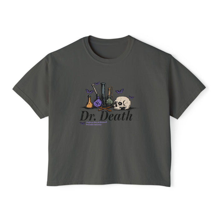 Nocticadia collection from thtgrlreads features a vintage-wash Comfort Colors dark gray crop top with gothic script "Dr. Death" text and whimsical alchemy bottle and skull graphic, part of fantasy romance Tees.