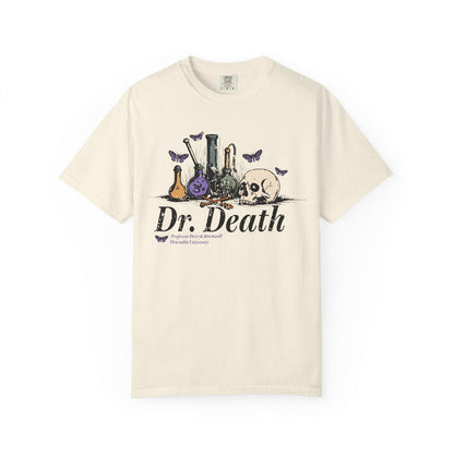 A vintage wash Comfort Colors graphic tee from thtgrlreads featuring a gothic design with laboratory glassware, a skull, and butterflies, inspired by Nocticadia themes.
