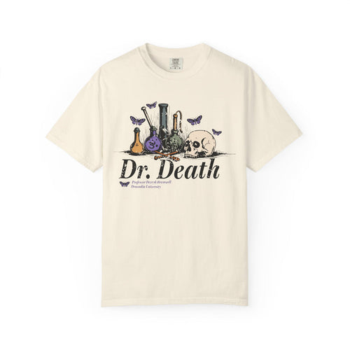 A vintage wash Comfort Colors graphic tee from thtgrlreads featuring a gothic design with laboratory glassware, a skull, and butterflies, inspired by Nocticadia themes.