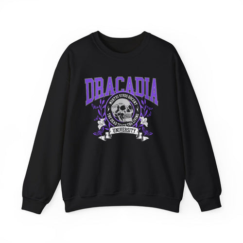 Nocticadia book merch by thtgrlreads featuring a black oversized crewneck sweatshirt with a vintage puff print graphic of "Dracadia University" in purple gothic font and a detailed skull emblem, part of the Crewnecks collection.