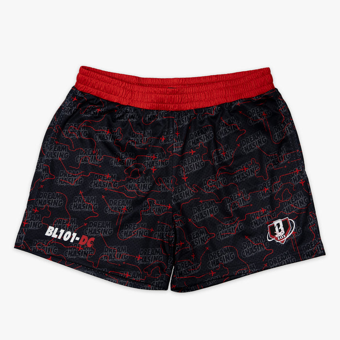Youth model wearing black Dream Chaser Red Eye youth shorts