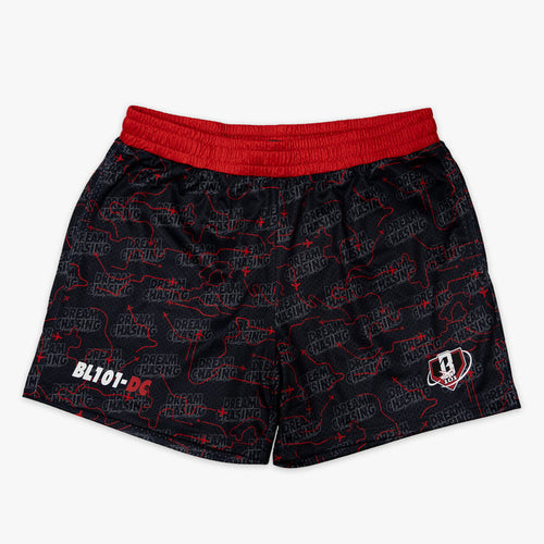 Youth model wearing black Dream Chaser Red Eye youth shorts