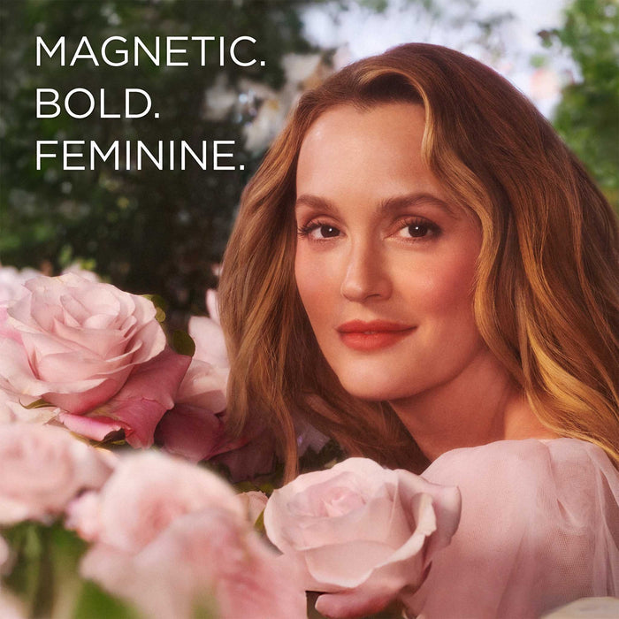 Leighton Meester in the background surrounded by florals. The Eternal Aura Eau de Parfum is magnetic, bold and feminine.