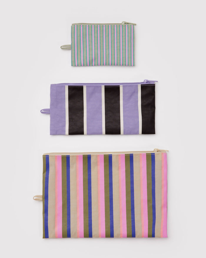Set of three flat zipper pouches with vertical striped prints in black, white, and pink
