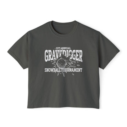 Liv Zander collection crop top from thtgrlreads featuring a vintage-wash Comfort Colors fabric with a bold white graphic reading "1st Annual Gravedigger Snowball Tournament" on a charcoal gray unisex cropped t-shirt.