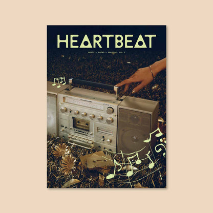 Music magazine cover with HEARTBEAT title and hand on an audio equipment panel