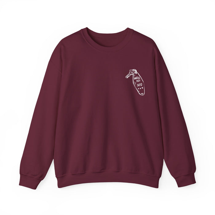 Thtgrlreads oversized crewneck sweatshirt from the Hockey Romance collection featuring a vintage wash Comfort Colors base in deep burgundy with a small minimalist graphic on the chest and relaxed unisex fit.