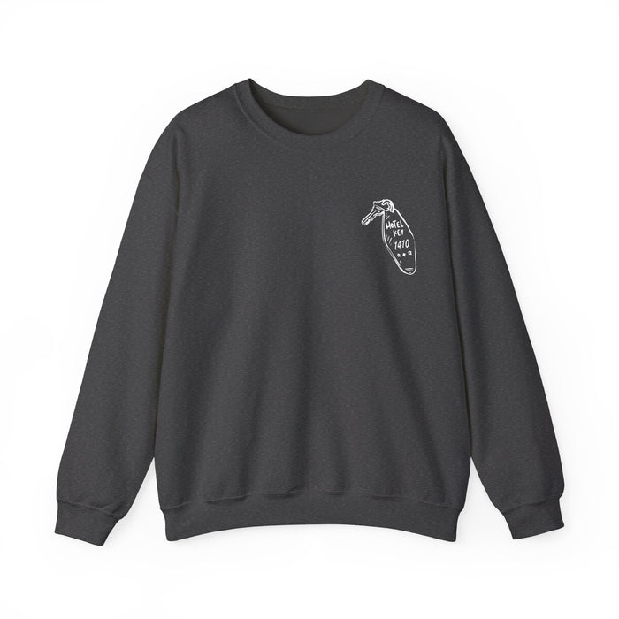 Thtgrlreads oversized crewneck sweatshirt from the Hockey Romance collection featuring a minimalist vintage white graphic on dark Comfort Colors fabric, combining cozy style with bookish flair.