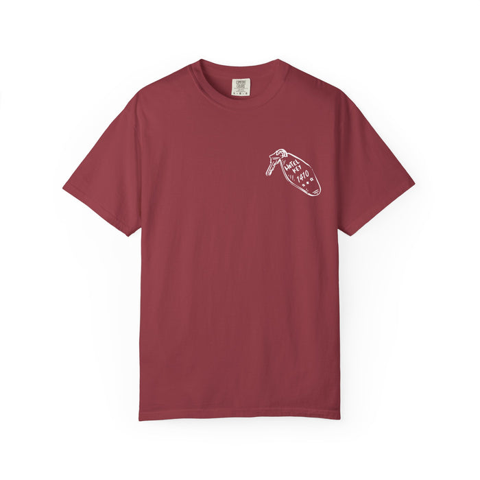 A vintage-wash Comfort Colors graphic tee in deep red from thtgrlreads, featuring a small white printed design of a hand holding a door hanger with text, part of the Hockey Romance collection.