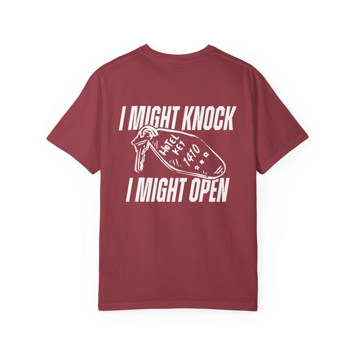 Unisex Comfort Colors graphic tee from thtgrlreads featuring a vintage washed burgundy base with white vintage puff print text reading "I Might Knock I Might Open" and a hotel key graphic, part of Hockey Romance and related collections.