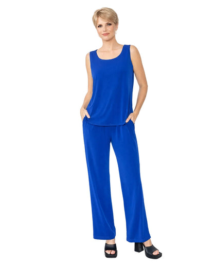 Woman wearing a royal blue matching 
sleeveless top and pants on a white background