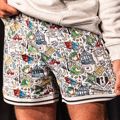 Close-up of the white Jackson Olson x BL101 Hometown Shorts highlighting the full all-over illustrated print, striped hem, and BL101 home plate logo
