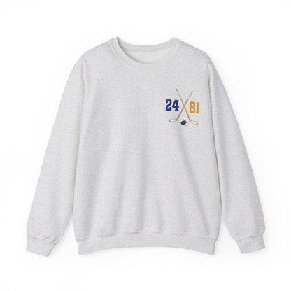 A vintage wash Comfort Colors crewneck sweatshirt by thtgrlreads featuring a small crossed hockey sticks graphic with numbers 24 and 81, part of the Hockey Romance collection.