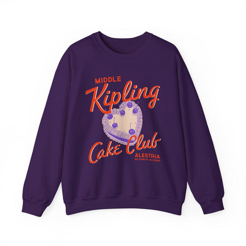 Ruthless Boys of the Zodiac collection oversized crewneck sweatshirt by thtgrlreads featuring vintage wash purple fabric with bold orange "Middle Kipling Cake Club" text and heart graphic in layered print style.
