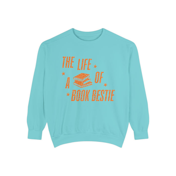 Thtgrlreads cozy oversized crewneck sweatshirt in vintage washed blue with orange vintage puff print text and stacked book graphic from the Life of a Book Bestie collection.