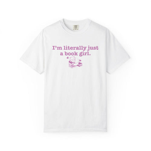 White Comfort Colors graphic tee from thtgrlreads featuring a pastel pink text and illustration design reading "I'm literally just a book girl" with a cat on stacked books, part of the Tees and Book Bestie collections.
