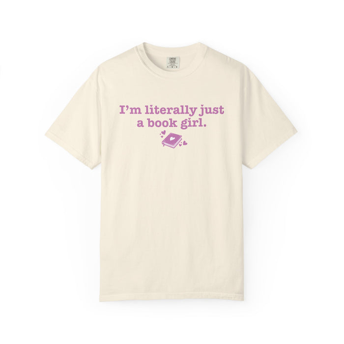 thtgrlreads Book Bestie collection cream Comfort Colors graphic tee with vintage wash, featuring pink printed text "I'm literally just a book girl" and a small book graphic.