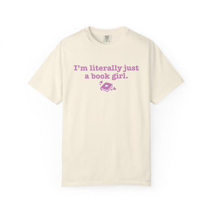 thtgrlreads Book Bestie collection cream Comfort Colors graphic tee with vintage wash, featuring pink printed text "I'm literally just a book girl" and a small book graphic.