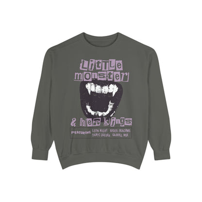 thtgrlreads Little Monster Sweatshirt from the Ruthless Boys of the Zodiac collection features a vintage wash oversized crewneck with a bold graphic of a monster mouth and stylized text, blending comfort and bookish fantasy style.