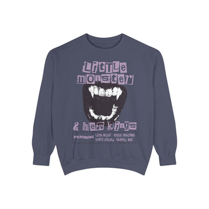 Thtgrlreads Ruthless Boys of the Zodiac collection oversized crewneck sweatshirt in vintage wash, featuring a bold graphic with distressed text and monster fang design in muted purple and black tones.