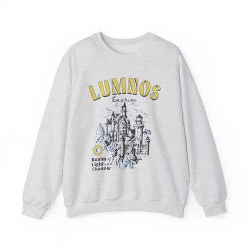 thtgrlreads Kindred's Curse Saga oversized crewneck sweatshirt in vintage-washed light gray with yellow and black graphic print of a fantasy castle and text "Lumnos" and "Realm of Light and Shadow," part of Crewnecks collection.