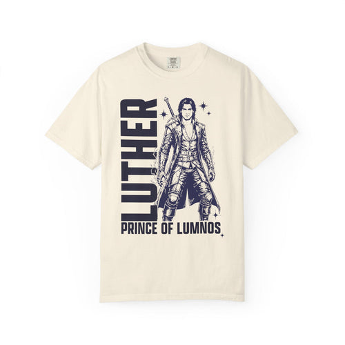 Cream Comfort Colors graphic tee from thtgrlreads featuring a vintage-style black print of Luther from the Kindred's Curse Saga with bold text "Luther Prince of Lumnos" in a unisex fit.