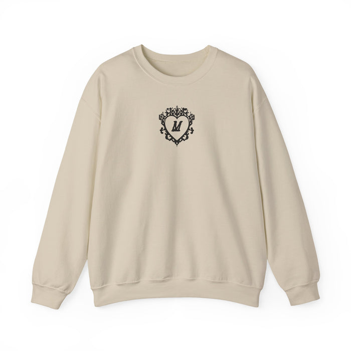thtgrlreads cream Comfort Colors oversized crewneck sweatshirt featuring a black vintage-style ornate heart design with a bold letter M in the center on the chest