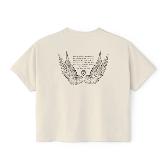 Liv Zander collection crop top from thtgrlreads featuring vintage-washed cream Comfort Colors fabric with detailed black wing illustration and poetic text in a romantic fantasy style.