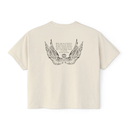 Liv Zander collection crop top from thtgrlreads featuring vintage-washed cream Comfort Colors fabric with detailed black wing illustration and poetic text in a romantic fantasy style.
