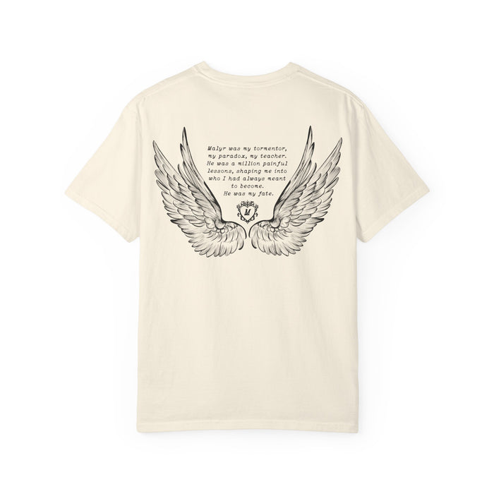 Liv Zander collection Comfort Colors graphic tee by thtgrlreads featuring vintage washed cream fabric with black detailed angel wings and poetic text printed on the back, part of Tees collection.