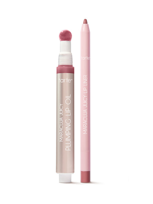 Lip oil and liner in pink, stand upright on a white surface. The oil features a sponge applicator; text reads tarte, MARACUJA JUICY PLUMPING LIP OIL, and MARACUJA JUICY LIP LINER.