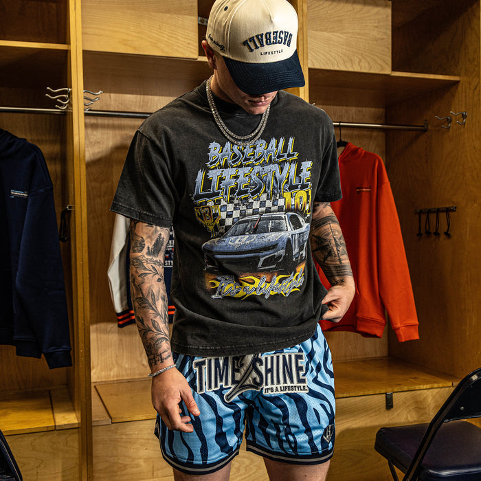 Adult model wearing blue Max Clark Tiger Court shorts