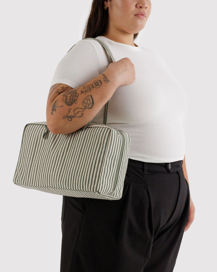 Medium nylon bowler bag with sage-and-white vertical stripes, long handles, side carry.