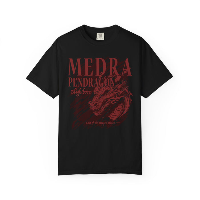 A black Comfort Colors graphic tee from thtgrlreads featuring a vintage wash and a dark red vintage puff print graphic of a dragon head with the text "Medra Pendragon Blightborn" and "Last of the dragon riders.