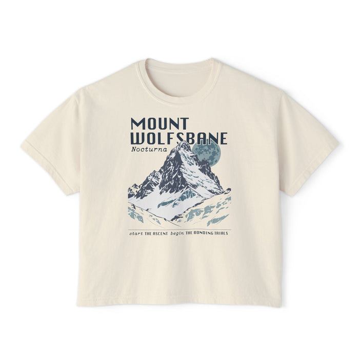 thtgrlreads Wolves of Ruin collection crop top featuring a vintage-wash Comfort Colors fabric with a graphic print of a snowy mountain scene and bold "Mount Wolfsbane" text.