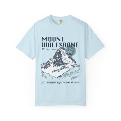 Thtgrlreads comfort colors graphic tee from the Wolves of Ruin collection featuring a vintage wash light blue fabric with a bold mountain print and stylized text referencing Mount Wolfsbane.