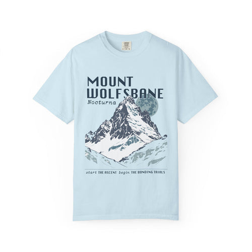 Thtgrlreads comfort colors graphic tee from the Wolves of Ruin collection featuring a vintage wash light blue fabric with a bold mountain print and stylized text referencing Mount Wolfsbane.