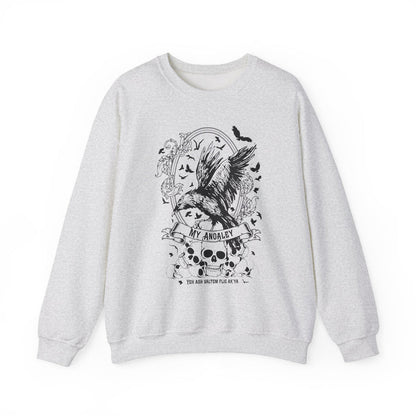 A Thtgrlreads Liv Zander collection oversized crewneck sweatshirt in vintage-washed Comfort Colors fabric featuring a black gothic-style print of a crow, skulls, roses, and flying bats with "My Anoaley" text.