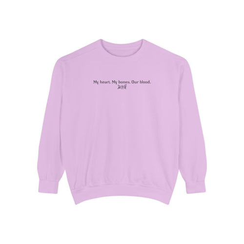 Officially licensed The Poison Daughter crewneck from thtgrlreads featuring a vintage-washed lavender Comfort Colors oversized sweatshirt with black gothic script text reading "My heart. My bones. Our blood.