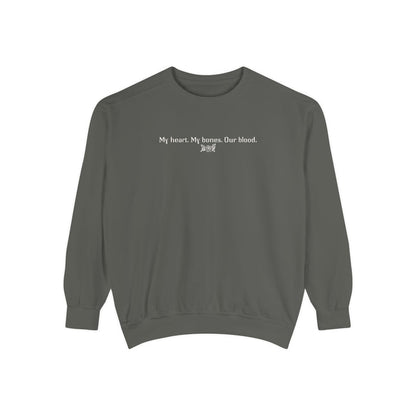 The Poison Daughter collection cozy crewneck sweatshirt by thtgrlreads in vintage-washed comfort colors fabric, featuring white minimalist text "My heart. My bones. Our blood." across the chest.