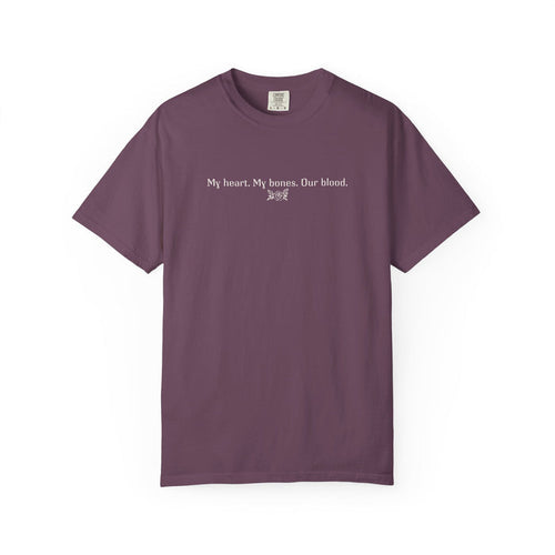 A vintage wash Comfort Colors graphic tee from thtgrlreads featuring a simple white text print reading "My heart. My bones. Our blood." inspired by The Poison Daughter collection.