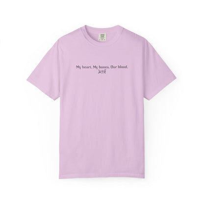 Thtgrlreads officially licensed The Poison Daughter comfort colors graphic tee in a soft lavender vintage wash featuring a minimalist black text design that reads "My heart. My bones. Our blood.