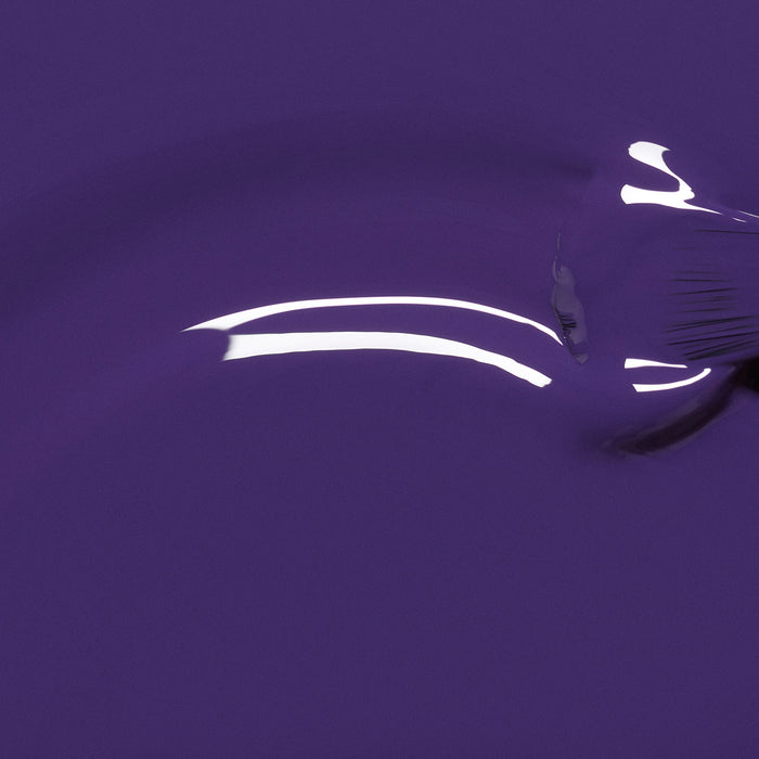 Mystic by Manucurist features a glossy blue-violet nail polish with an opaque finish, white reflected highlights, and subtle texture on the right side.